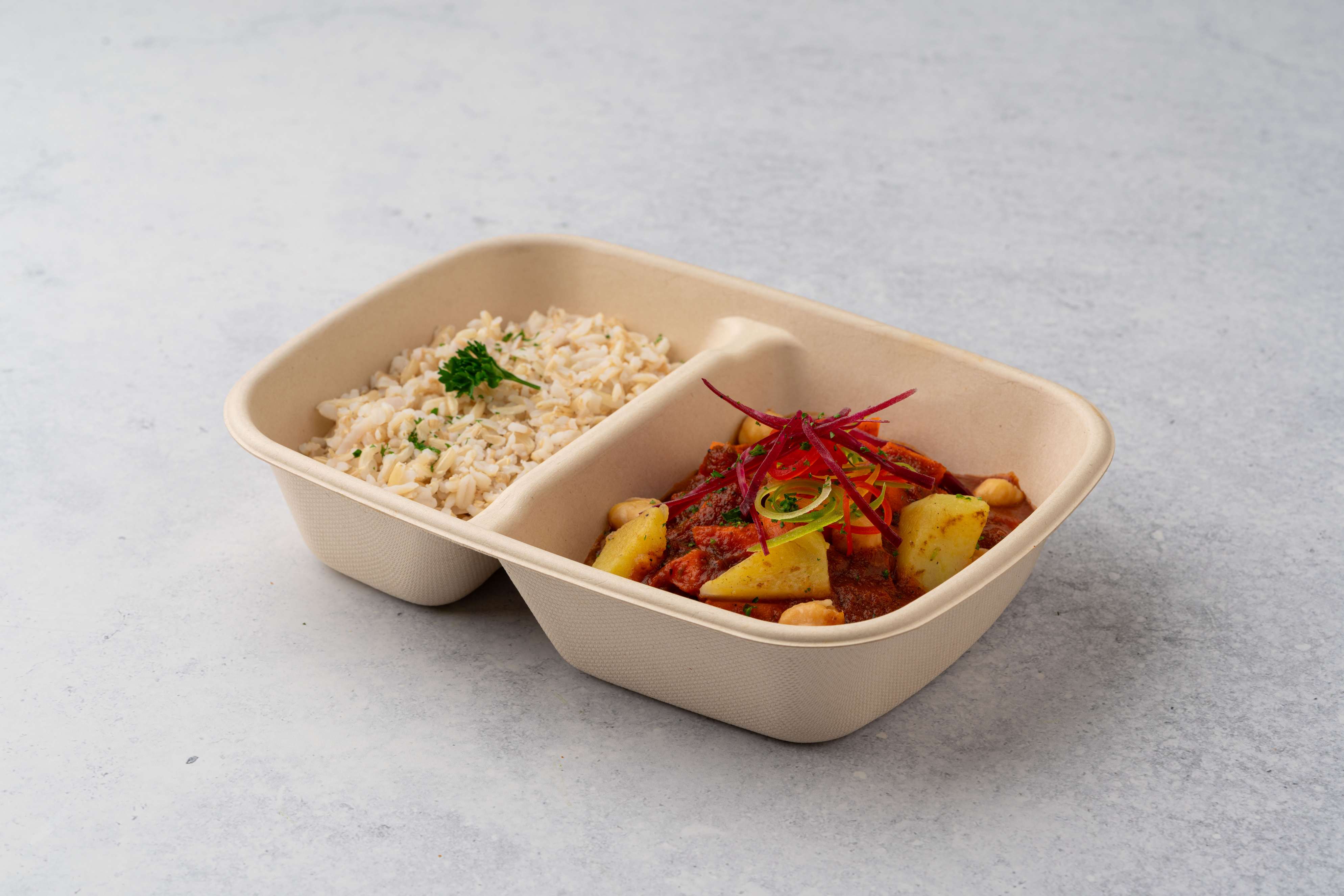 Moroccan Chickipes Stew With Sweet Potato Potatos And Carrot With Brown Rice